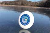 Frisbee On A Frozen Lake On A Windy Day