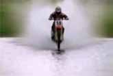Motorcycle Skims Over Water