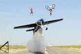 World First: Plane Flies Under Back Flipping Motorcycle And Highliner